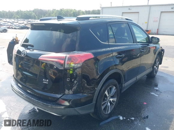 2016 Toyota RAV4 XLE with VIN 2T3RFREV9GW458057, listed as a IAAI auction lot 42651373 with 119,750 mi miles and . Bid and sale history available at DreamBid. Image 4.