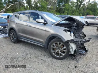 2017 Hyundai Santa Fe Ultimate z VIN 5XYZW4LA8HG491652, wystawiony jako Copart lot #56907985 z przebiegiem Nie podano mil oraz Szkoda całkowita • Salvage title. Historia ofert i sprzedaży dostępna na DreamBid. Obrazek 4.
