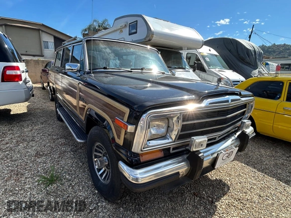1987 Jeep Grand Wagoneer z VIN 1JCNJ15U7HT153505, wystawiony jako Copart lot #46373925 z przebiegiem 57 931 mil mil oraz Czysty tytuł • Clean title. Historia ofert i sprzedaży dostępna na DreamBid. Obrazek 1.