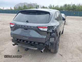 2021 Ford Escape SE z VIN 1FMCU0G62MUA94307, wystawiony jako IAAI lot #42018728 z przebiegiem 142 662 mil mil oraz . Historia ofert i sprzedaży dostępna na DreamBid. Obrazek 4.