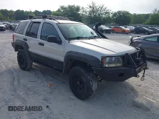 2003 Jeep Grand Cherokee Laredo z VIN 1J8GW48S33C519680, wystawiony jako IAAI lot #42126714 z przebiegiem 295 517 mil mil oraz . Historia ofert i sprzedaży dostępna na DreamBid. Obrazek 1.
