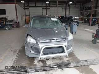 2014 Ford Escape Titanium with VIN 1FMCU9J90EUC31625, listed as a IAAI auction lot 41492075 with 301,917 mi miles and . Bid and sale history available at DreamBid. Image 12.
