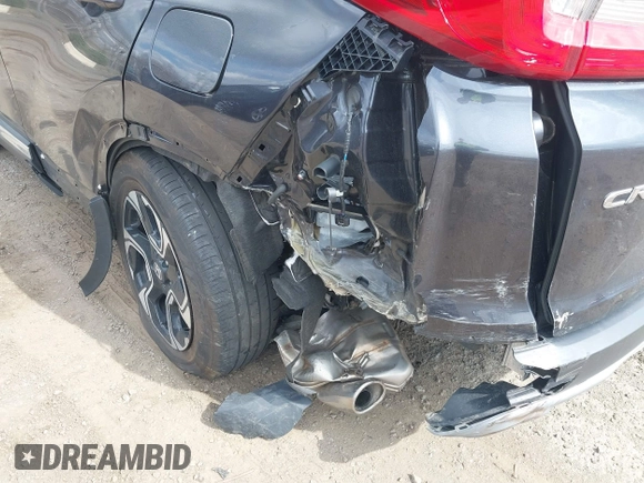 2019 Honda CR-V Touring with VIN 2HKRW2H9XKH636354, listed as a IAAI auction lot 41902615 with 66,781 mi miles and . Bid and sale history available at DreamBid. Image 6.