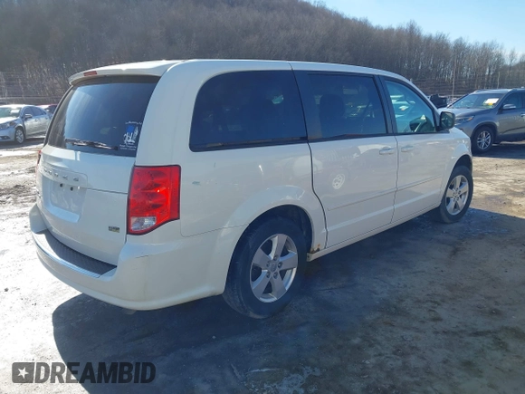 2013 Dodge Grand Caravan SE with VIN 2C4RDGBG0DR760598, listed as a IAAI auction lot 41590428 with 182,847 mi miles and . Bid and sale history available at DreamBid. Image 4.