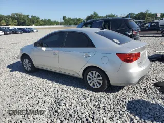 2010 Kia Forte LX with VIN KNAFT4A23A5107621, listed as a Copart auction lot 53696985 with 124,833 mi miles and Salvage Title. Bid and sale history available at carsss.com. Image 2.