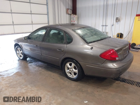 2003 Ford Taurus SE Standard z VIN 1FAFP53UX3G167579, wystawiony jako IAAI lot #42140606 z przebiegiem 178 147 mil mil oraz . Historia ofert i sprzedaży dostępna na DreamBid. Obrazek 3.