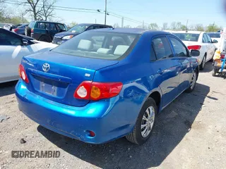 2009 Toyota Corolla with VIN 1NXBU40EX9Z065519, listed as a IAAI auction lot 42057981 with 201,480 mi miles. Bid and sale history available at carsss.com. Image 4.