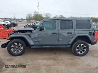 2022 Jeep Wrangler Unlimited Sahara with VIN 1C4HJXEG7NW138105, listed as a IAAI auction lot 42146898 with Not provided miles and . Bid and sale history available at DreamBid. Image 15.