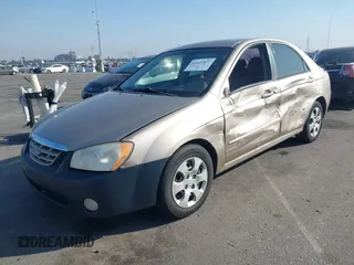 2004 Kia Spectra LX with VIN KNAFE122145013930, listed as a IAAI auction lot 41627031 with 93,565 mi miles. Bid and sale history available at carsss.com. Image 2.