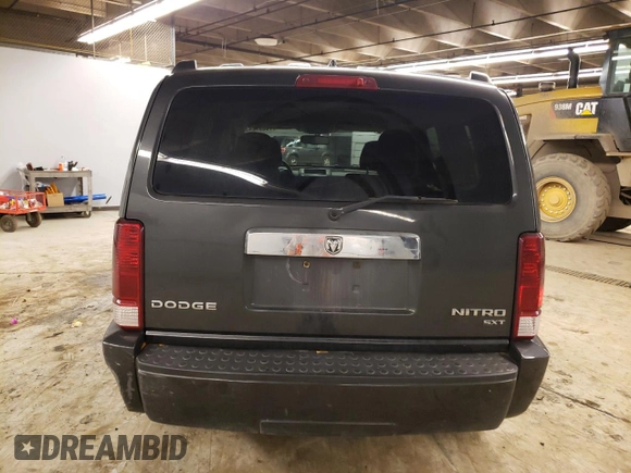 2011 Dodge Nitro SXT z VIN 1D4PT5GK1BW544942, wystawiony jako Copart lot #79857243 z przebiegiem 128 613 mil mil oraz Czysty tytuł • Clean title. Historia ofert i sprzedaży dostępna na DreamBid. Obrazek 6.