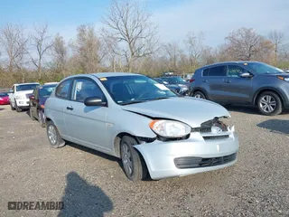 2010 Hyundai Accent GS with VIN KMHCM3AC2AU164786, listed as a IAAI auction lot 41995191 with 148,174 mi miles. Bid and sale history available at carsss.com. Image 1.