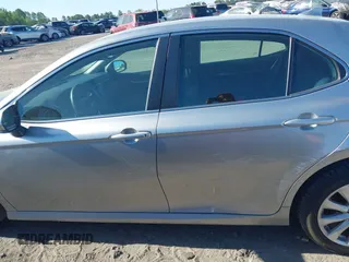 2019 Toyota Camry LE z VIN 4T1B11HK7KU756675, wystawiony jako IAAI lot #42063923 z przebiegiem 132 312 mil mil oraz . Historia ofert i sprzedaży dostępna na DreamBid. Obrazek 14.