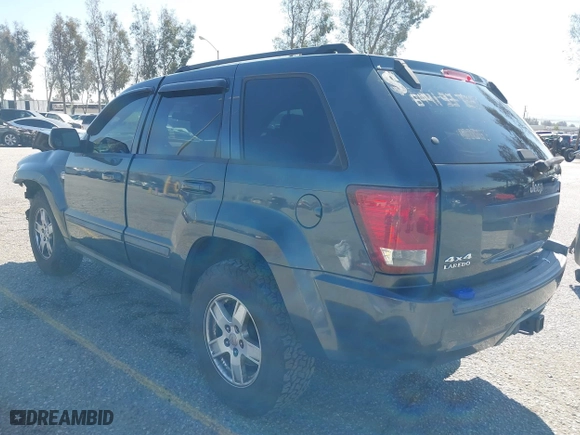 2007 Jeep Grand Cherokee Laredo with VIN 1J8HR48PX7C660601, listed as a IAAI auction lot 41652509 with 131,556 mi miles. Bid and sale history available at carsss.com. Image 3.