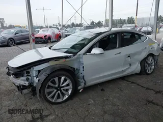 2020 Tesla Model 3 Long Range with VIN 5YJ3E1EB5LF801530, listed as a IAAI auction lot 41682050 with 65,743 mi miles. Bid and sale history available at carsss.com. Image 2.