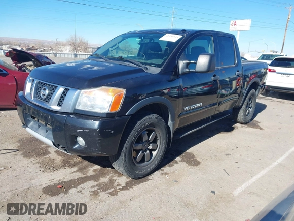 2014 Nissan Titan S with VIN 1N6AA0EC6EN506928, listed as a IAAI auction lot 41380319 with 102,669 mi miles and . Bid and sale history available at DreamBid. Image 2.