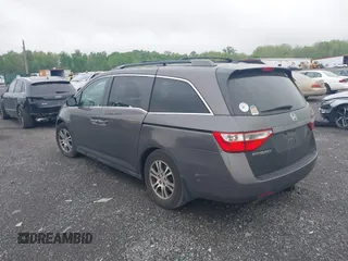 2012 Honda Odyssey EX-L with VIN 5FNRL5H64CB060468, listed as a IAAI auction lot 42182501 with 236,399 mi miles and . Bid and sale history available at carsss.com. Image 3.