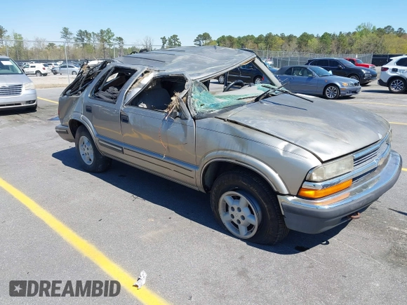 1999 Chevrolet Blazer Trailblazer z VIN 1GNDT13W4X2162282, wystawiony jako IAAI lot #41863705 z przebiegiem 220 358 mil mil oraz . Historia ofert i sprzedaży dostępna na DreamBid. Obrazek 1.