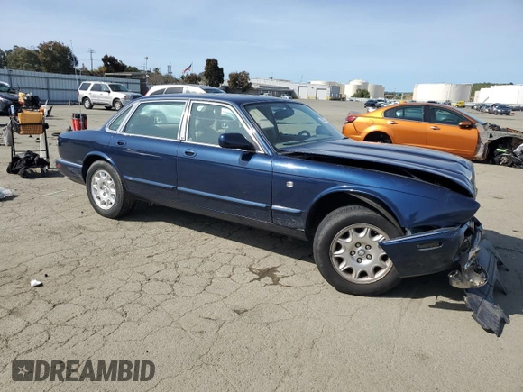 2000 Jaguar XJ with VIN SAJDA14C7YLF18873, listed as a Copart auction lot 50032495 with Not Provided miles and Salvage Title. Bid and sale history available at DreamBid. Image 4.