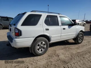 2001 Isuzu Rodeo S z VIN 4S2DM58W114306215, wystawiony jako Copart lot #85287914 z przebiegiem 157 844 mil mil oraz Szkoda całkowita • Salvage title. Historia ofert i sprzedaży dostępna na DreamBid. Obrazek 3.