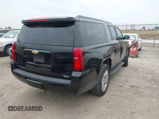 2015 Chevrolet Suburban LT with VIN 1GNSCJKC1FR304656, listed as a IAAI auction lot 42071124 with 133,140 mi miles. Bid and sale history available at carsss.com. Image 4.