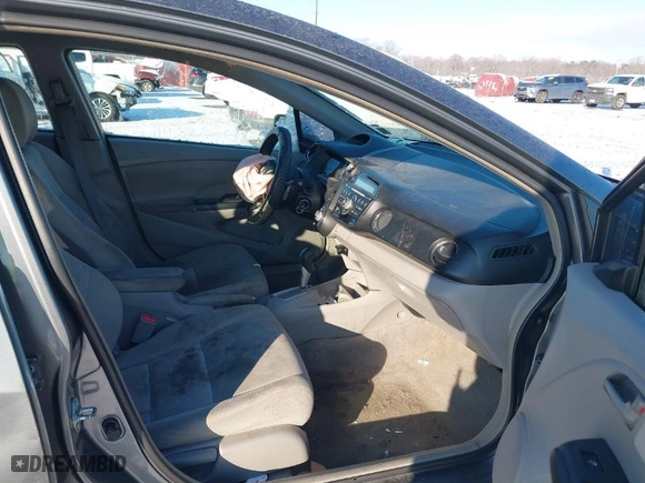 2011 Honda Insight EX with VIN JHMZE2H76BS004162, listed as a IAAI auction lot 41333373 with 287,593 mi miles. Bid and sale history available at carsss.com. Image 5.