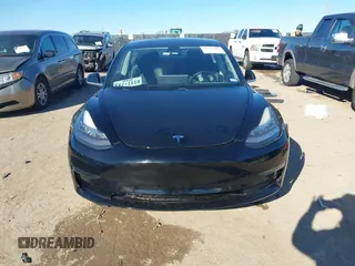 2018 Tesla Model 3 Long Range Battery with VIN 5YJ3E1EA2JF014975, listed as a IAAI auction lot 41319407 with 106,301 mi miles and . Bid and sale history available at DreamBid. Image 12.