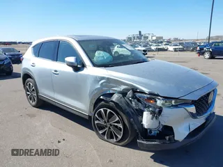 2023 Mazda CX-5 2.5 S Premium Package with VIN JM3KFBDM9P0173453, listed as a IAAI auction lot 41807979 with 34,156 mi miles. Bid and sale history available at carsss.com. Image 1.