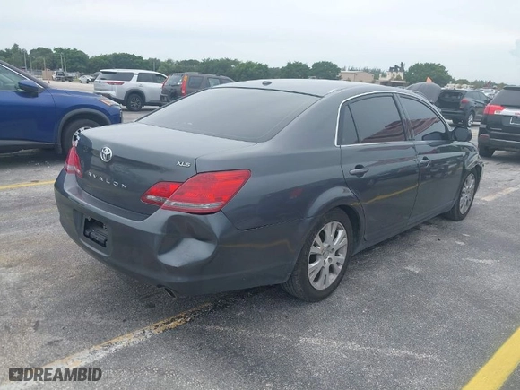 2009 Toyota Avalon XL with VIN 4T1BK36BX9U326676, listed as a IAAI auction lot 40436762 with 137,905 mi miles. Bid and sale history available at carsss.com. Image 4.