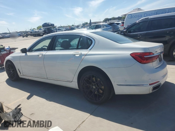 2018 BMW 7 Series 740i xDrive with VIN WBA7E4C52JGV24125, listed as a Copart auction lot 48164214 with 77,695 mi miles. Bid and sale history available at carsss.com. Image 2.