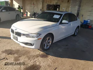 2013 BMW 3 Series 328i xDrive with VIN WBA3B5C56DF596114, listed as a IAAI auction lot 41313136 with 98,847 mi miles. Bid and sale history available at carsss.com. Image 2.
