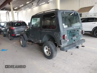 2000 Jeep Wrangler Sport with VIN 1J4FA49S8YP780104, listed as a IAAI auction lot 42095731 with Not provided miles and . Bid and sale history available at DreamBid. Image 3.