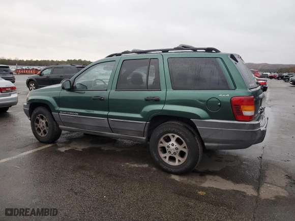 1999 Jeep Grand Cherokee Laredo with VIN 1J4GW58N0XC684111, listed as a Copart auction lot 85944784 with 128,741 mi miles and Salvage Title. Bid and sale history available at carsss.com. Image 2.