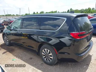 2023 Chrysler Pacifica Hybrid Touring L with VIN 2C4RC1L70PR622000, listed as a IAAI auction lot 42711826 with 65,109 mi miles and . Bid and sale history available at DreamBid. Image 15.