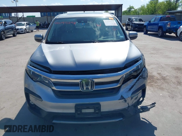 2020 Honda Pilot EX-L with VIN 5FNYF5H46LB004744, listed as a IAAI auction lot 42095298 with 76,159 mi miles and . Bid and sale history available at DreamBid. Image 11.