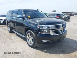 2017 Chevrolet Suburban Premier with VIN 1GNSCJKC5HR394736, listed as a IAAI auction lot 41628570 with 125,085 mi miles and . Bid and sale history available at DreamBid. Image 1.