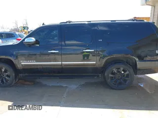 2010 Chevrolet Suburban LTZ with VIN 1GNUKKE39AR106851, listed as a IAAI auction lot 41994155 with 148,776 mi miles. Bid and sale history available at carsss.com. Image 14.