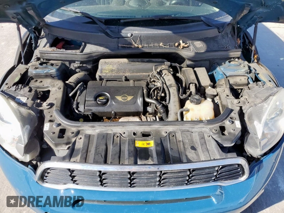 2012 MINI Countryman S with VIN WMWZC3C5XCWM27675, listed as a Copart auction lot 49676205 with 111,499 mi miles and Salvage title. Bid and sale history available at DreamBid. Image 11.