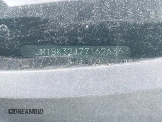 2007 Mazda 3 S Touring with VIN JM1BK324771626363, listed as a IAAI auction lot 41487684 with 220,889 mi miles and . Bid and sale history available at DreamBid. Image 9.