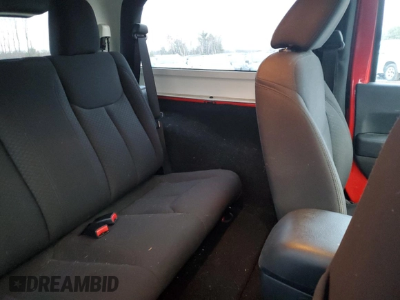 2015 Jeep Wrangler Willys Wheeler with VIN 1C4AJWAG9FL543998, listed as a Copart auction lot 88947025 with 142,433 mi miles and Salvage title. Bid and sale history available at DreamBid. Image 11.