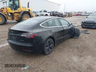 2018 Tesla Model 3 Long Range Battery with VIN 5YJ3E1EB1JF127289, listed as a IAAI auction lot 41484253 with 60,577 mi miles and . Bid and sale history available at DreamBid. Image 4.