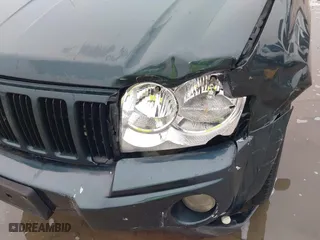 2005 Jeep Grand Cherokee Laredo with VIN 1J4GS48K45C677011, listed as a IAAI auction lot 41121018 with 210,814 mi miles. Bid and sale history available at carsss.com. Image 20.