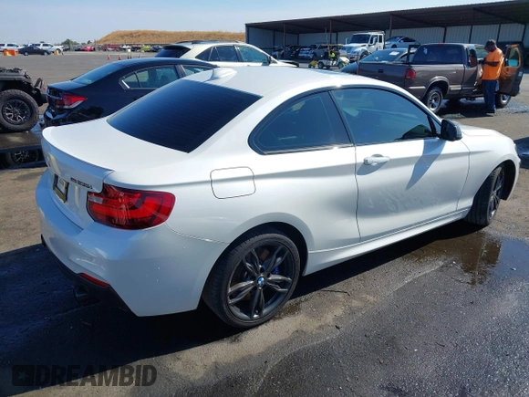 2016 BMW 2 Series M235i with VIN WBA1J7C5XGV359562, listed as a IAAI auction lot 39990299 with 54,022 mi miles. Bid and sale history available at carsss.com. Image 4.