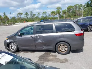 2015 Toyota Sienna XLE with VIN 5TDYK3DC3FS556859, listed as a IAAI auction lot 42161107 with 200,502 mi miles and . Bid and sale history available at DreamBid. Image 14.