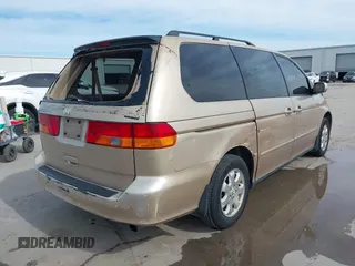 2002 Honda Odyssey EX-L z VIN 2HKRL18042H567858, wystawiony jako IAAI lot #41686147 z przebiegiem 264 570 mil mil oraz . Historia ofert i sprzedaży dostępna na DreamBid. Obrazek 4.