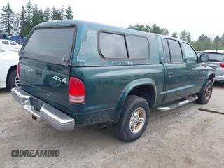 2000 Dodge Dakota Sport z VIN 1B7GG2AN4YS760836, wystawiony jako IAAI lot #42472312 z przebiegiem 230 401 mil mil oraz . Historia ofert i sprzedaży dostępna na DreamBid. Obrazek 4.