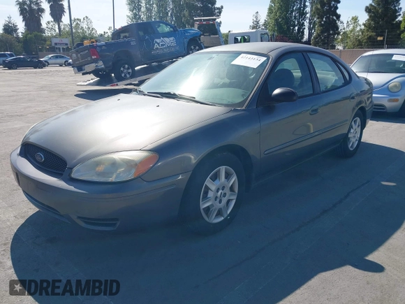 2005 Ford Taurus SE with VIN 1FAFP53U95A289971, listed as a IAAI auction lot 42143134 with 167,702 mi miles. Bid and sale history available at carsss.com. Image 2.