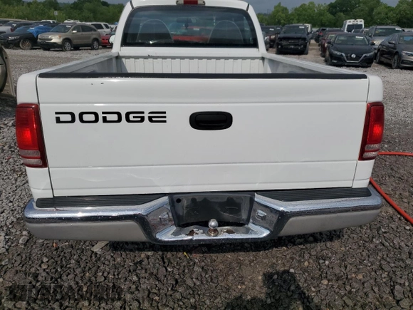 1999 Dodge Dakota SLT z VIN 1B7FL26X3XS170126, wystawiony jako Copart lot #54621095 z przebiegiem 192 965 mil mil oraz Szkoda całkowita • Salvage title. Historia ofert i sprzedaży dostępna na DreamBid. Obrazek 6.