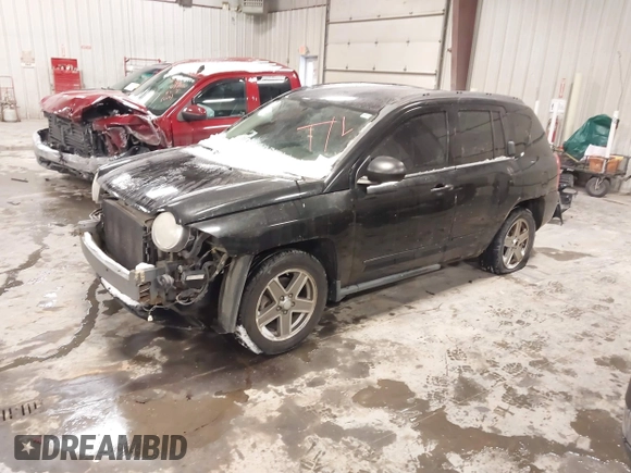 2010 Jeep Compass Sport with VIN 1J4NF4FB0AD501897, listed as a IAAI auction lot 41570009 with 198,376 mi miles. Bid and sale history available at carsss.com. Image 2.