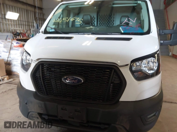 2021 Ford Transit Cargo with VIN 1FTBR1Y87MKA76372, listed as a IAAI auction lot 42251675 with 98,072 mi miles and . Bid and sale history available at DreamBid. Image 12.