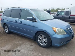 2010 Honda Odyssey Touring with VIN 5FNRL3H93AB008129, listed as a IAAI auction lot 42115112 with 260,075 mi miles. Bid and sale history available at carsss.com. Image 1.